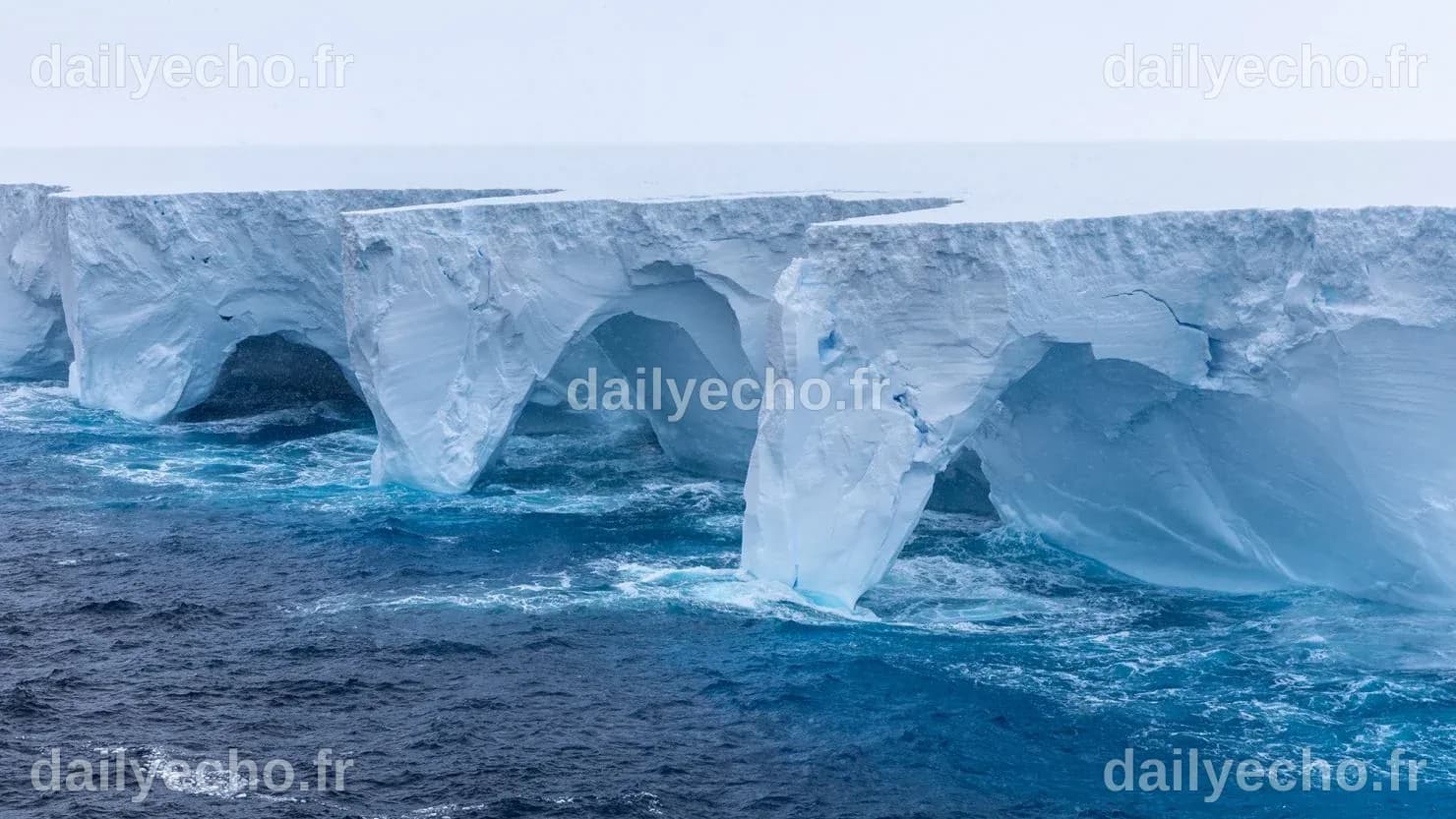A23a iceberg seen with striking arches and cavernous hollows as it ...